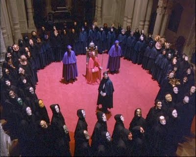 The PRIEST in centre of RING